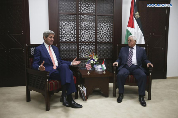Palestinian President Mahmoud Abbas (R) meets with the U.S. Secretary of State John Kerry upon his arrival to the west bank city of Ramallah on Nov. 24, 2015. [Photo/Xinhua]