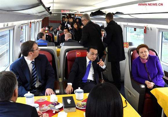 Chinese Premier Li Keqiang (2nd L, 2nd row) invites leaders attending the fourth China and Central and Eastern European (CEE) countries leaders' meeting to a ride on a China-made bullet train from Suzhou to Shanghai, Nov. 25, 2015. [Photo/Xinhua]