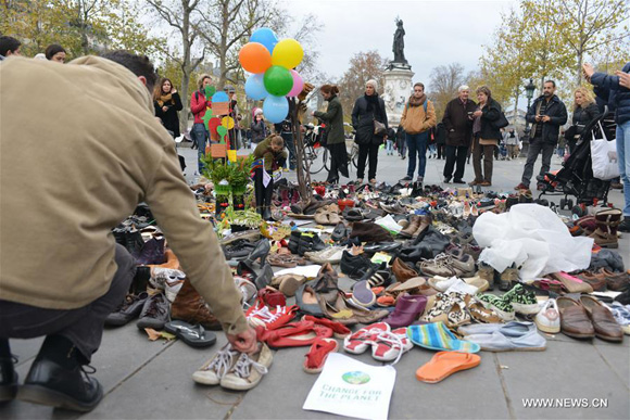 Picture taken on Nov. 29, 2015 shows some of the shoes on the Place de la Republique in downtown Paris, France, as part of a peaceful rally called by the NGO Avaaz 'Paris sets off for climate', as an attempt to protest the French authorities' ban on public gatherings. [Photo/Xinhua]