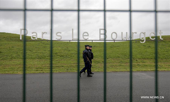 Policemen patrol at Le Bourget where the 2015 United Nations Climate Change Conference (COP 21) will take place in Paris, France, Nov. 29, 2015. [Photo/Xinhua]