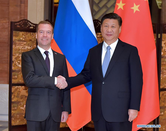 Chinese President Xi Jinping (R) meets with Russian Prime Minister Dmitry Medvedev in Wuzhen, east China's Zhejiang Province, Dec. 15, 2015. [Photo/Xinhua]