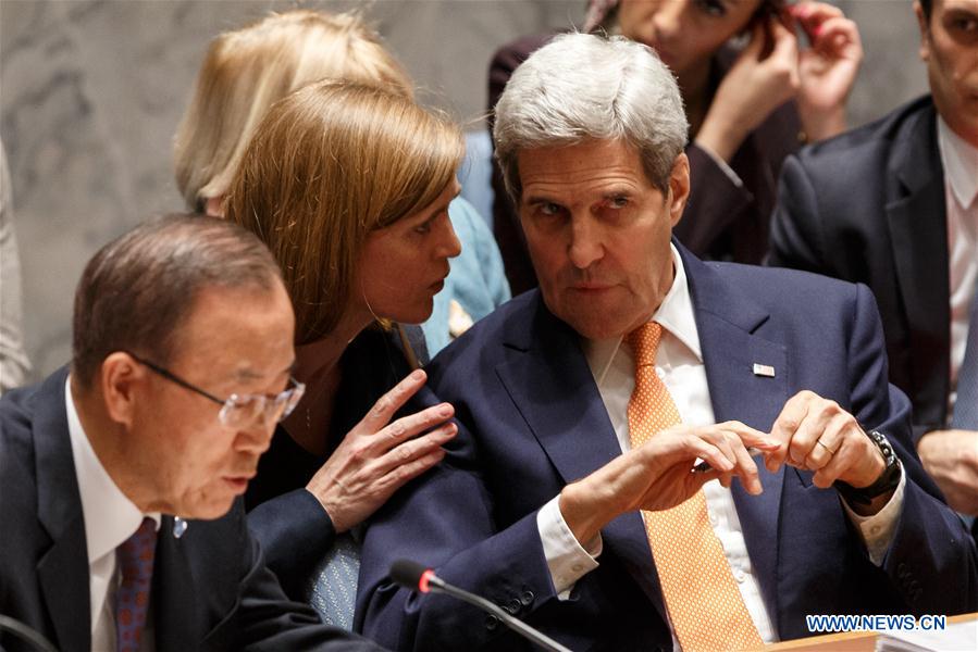 U.S. Secretary of State John Kerry (R) listens to Samantha Power (C), U.S. permanent representative to the United Nations, during a United Nations Security Council meeting on Syria at the UN headquarters in New York, Dec. 18, 2015. The UN Security Council on Friday adopted a resolution endorsing an international roadmap for a Syrian-led political transition in order to end the country&apos;s conflict, which calls for Syria peace talks to begin in early January.