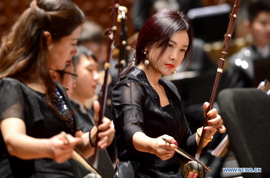 Artists from the China National Traditional Orchestra perform on a media preview at the Lincoln Center, in New York, the United States, Dec. 18, 2015. The China National Traditional Orchestra is to stage two performances of traditional Chinese music in New York. &apos;Splendor of Folk Music&apos; will be performed at Lincoln Center on Friday and the &apos;Rediscover Chinese Music&apos; at the Carnegie Hall on Sunday.