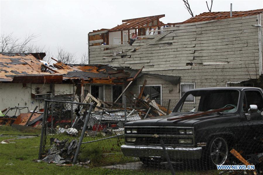 A dwelling house damaged by tornadoes is seen in Garland, Dallas, the United States on Dec. 27, 2015. Tornadoes swept through the northern part of the southern U.S. state of Texas on Saturday night, killing eleven people and causing substantial material damage. (Xinhua/Song Qiong) 