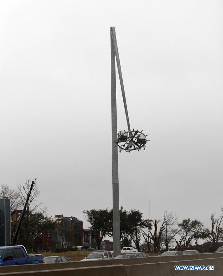 A road lamp damaged by tornadoes is seen in Garland, Dallas, the United States on Dec. 27, 2015. Tornadoes swept through the northern part of the southern U.S. state of Texas on Saturday night, killing eleven people and causing substantial material damage. (Xinhua/Song Qiong) 