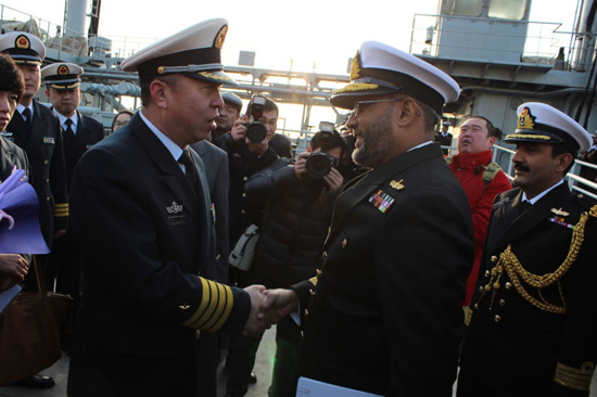 Chinese PLA Navy's Senior Captain Wei Xiaodong chief of staff at the Shanghai Naval Garrison receiving mission commander Commodore Bilal Abdul Nasir on the jetty during an impressive welcome ceremony in Shanghai on 28th Dec.,2015. [Photo/Embassy of Pakistan in Beijing]