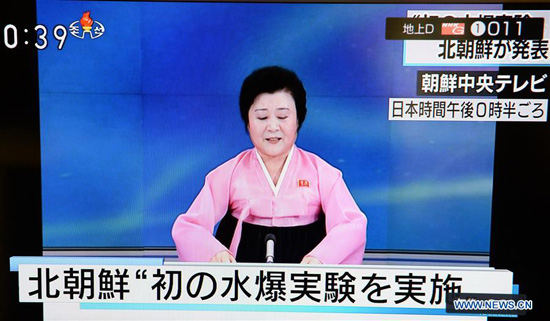 Photo taken on Jan. 6, 2015 in Tokyo, Japan shows a TV hostess of the Democratic People's Republic of Korea (DPRK) reads news during the broadcast. The Democratic People's Republic of Korea (DPRK) announced Wednesday that it has successfully carried out its first hydrogen bomb test. [Photo/Xinhua]