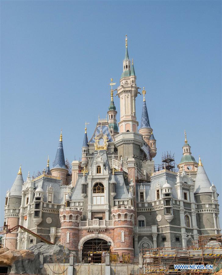Photo taken on Nov. 14, 2015 shows the castle of Shanghai Disney Resort under construction in east China's Shanghai. Shanghai Disney Resort will officially open and welcome its first guests on June 16, the Walt Disney Company and Shanghai Shendi Group announced Wednesday. Construction of the resort, the sixth of its kind worldwide, started in 2011 with an investment of 34 billion yuan (about US$5.5 billion). [Xinhua]