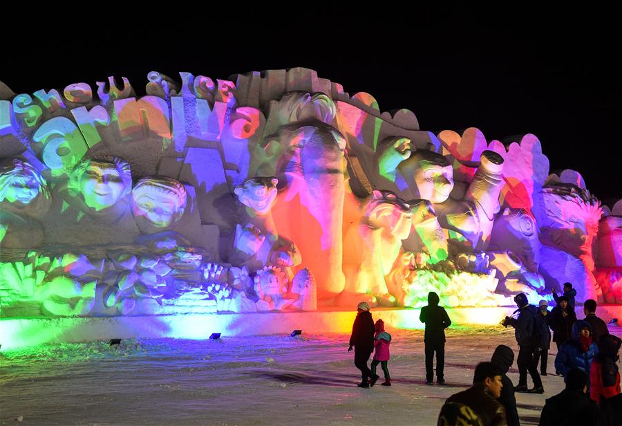  Tourists look at snow sculptures on Changbai Mountain, northeast China&apos;s Jilin Province, Jan. 15, 2016.