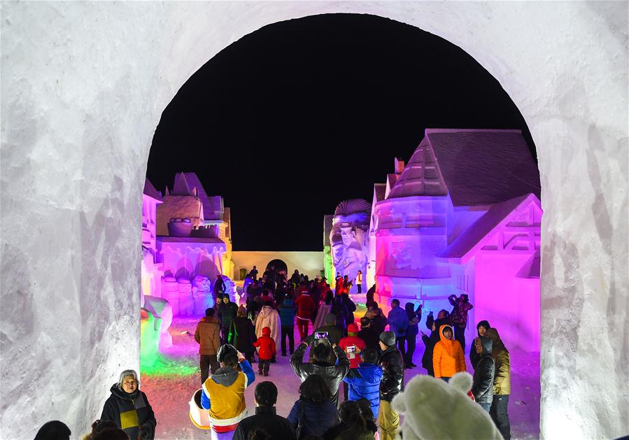 Tourists look at snow sculptures on Changbai Mountain, northeast China&apos;s Jilin Province, Jan. 15, 2016.