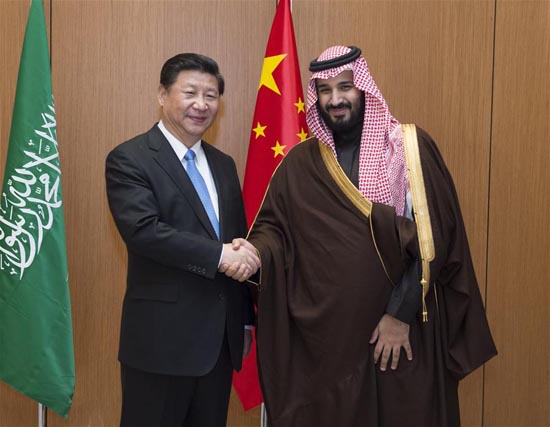 Chinese President Xi Jinping (L) meets with Saudi Deputy Crown Prince Mohammed bin Salman in Riyadh, Saudi Arabia, Jan. 19, 2016. Xi arrived here on Tuesday for a state visit to Saudi Arabia, the first stop of his three-nation tour of the Middle East. [Photo/Xinhua]