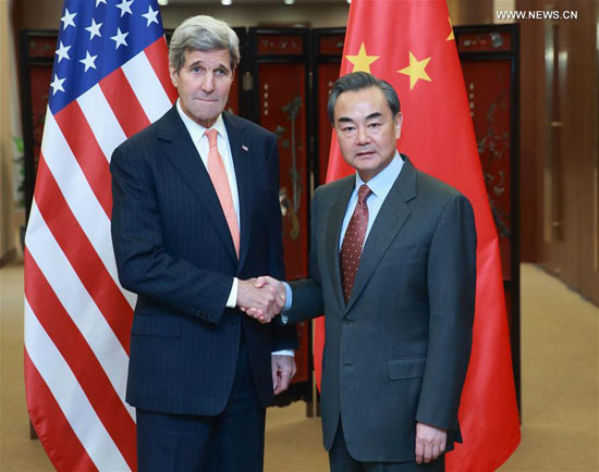 Chinese Foreign Minister Wang Yi (R) shakes hands with U.S. Secretary of State John Kerry in Beijing, capital of China, Jan. 27, 2016. [Photo/Xinhua]