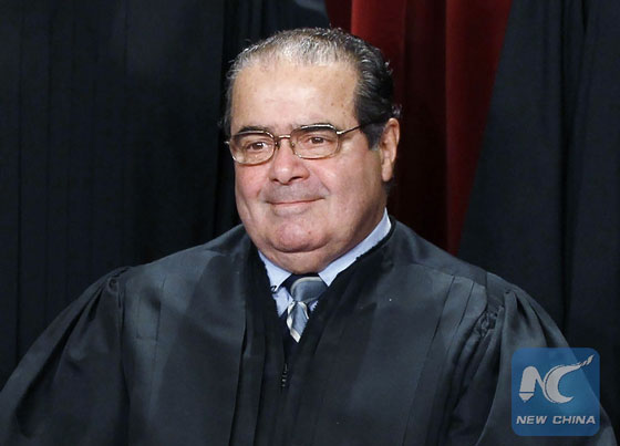 U.S. Supreme Court Justice Antonin Scalia is seen during a group portrait in the East Conference Room at the Supreme Court Building in Washington, in this file photo taken Oct. 8, 2010. [File photo/Xinhua]
