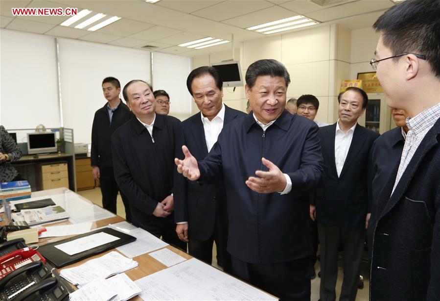 Chinese President Xi Jinping (2nd R, front) talks with a correspondent who is just back from a reporting in Zhengding County of Hebei Province, at the headquarters of Xinhua News Agency in Beijing, capital of China, on Feb. 19, 2016. Xi on Friday visited the People&apos;s Daily, Xinhua News Agency and China Central Television, the nation&apos;s three leading news providers.