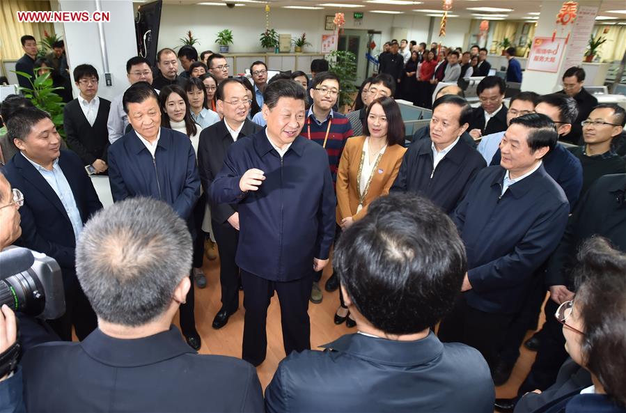 Chinese President Xi Jinping (C) talks with editors at the general newsroom of the People&apos;s Daily in Beijing, capital of China, on Feb. 19, 2016. Xi on Friday visited the People&apos;s Daily, Xinhua News Agency and China Central Television, the nation&apos;s three leading news providers.