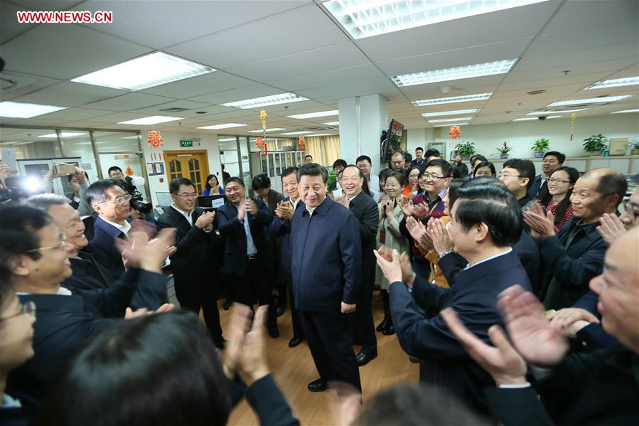 Chinese President Xi Jinping (C) talks with editors at the general newsroom of the People&apos;s Daily in Beijing, capital of China, on Feb. 19, 2016. Xi on Friday visited the People&apos;s Daily, Xinhua News Agency and China Central Television, the nation&apos;s three leading news providers. 