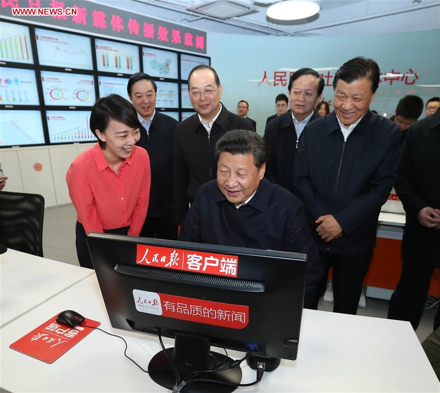 Chinese President Xi Jinping (front) uses a new media broadcasting system to extend Lantern Festival greetings to the public at the headquarters of the People&apos;s Daily in Beijing, capital of China, on Feb. 19, 2016. Xi on Friday visited the People&apos;s Daily, Xinhua News Agency and China Central Television, the nation&apos;s three leading news providers.