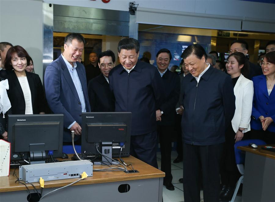 Chinese President Xi Jinping (C) is shown the studio where China Central Television (CCTV) Evening News Bulletin, or &apos;Xinwen Lianbo,&apos; is filmed at the headquarters of CCTV in Beijing, capital of China, on Feb. 19, 2016. Xi on Friday visited the People&apos;s Daily, Xinhua News Agency and CCTV, the nation&apos;s three leading news providers. (Xinhua/Yao Dawei) 