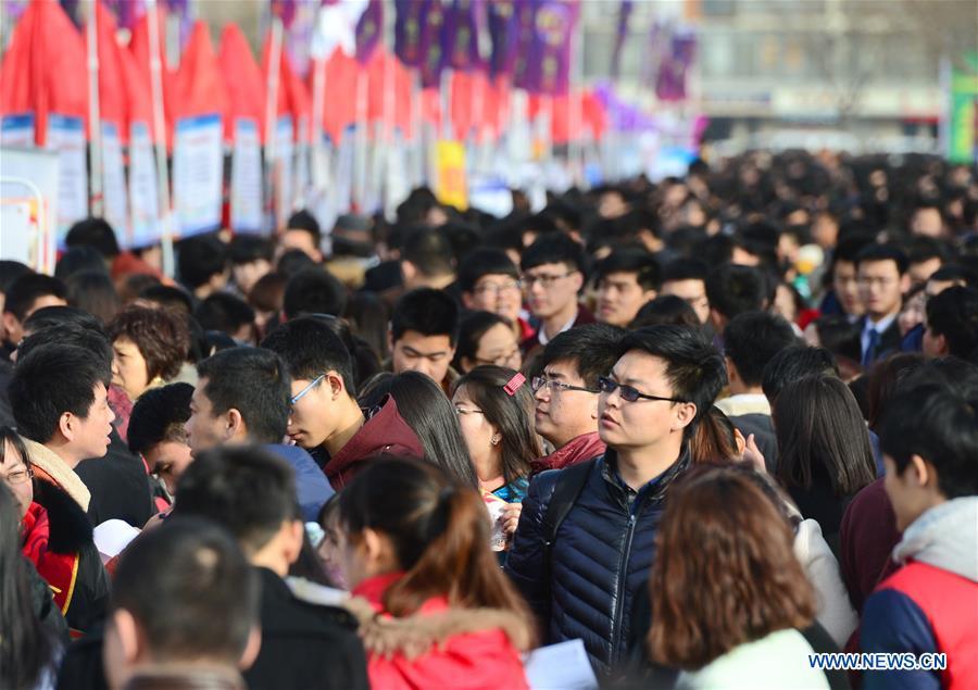 Graduates attend a job fair in Shijiazhuang, capital of north China&apos;s Hebei Province, Feb. 19, 2016. Over 40, 000 jobs were offered during the job fair. [Xinhua/Zhu Xudong]