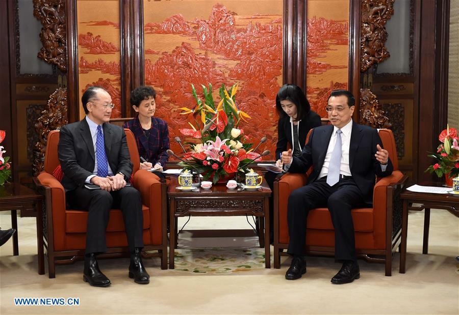 Chinese Premier Li Keqiang meets with World Bank's President Jim Yong Kim in Beijing, capital of China, Feb. 24, 2016. [Photo: Xinhua/Rao Aimin]