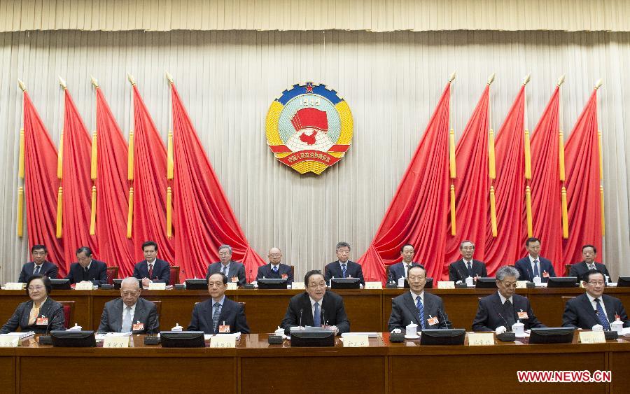 Yu Zhengsheng (C front), Chairman of the National Committee of the Chinese People's Political Consultative Conference (CPPCC), presides over the opening meeting of the 9th session of the Standing Committee of the 12th CPPCC National Committee in Beijing, capital of China on Feb. 27, 2015. [Photo: Xinhua]