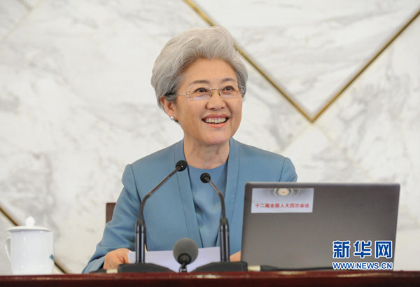 Fu Ying, spokesperson for the fourth session of China's 12th National People's Congress (NPC), answers questions during a press conference on the session at the Great Hall of the People in Beijing on Friday. The fourth session of the 12th NPC is scheduled to open on Saturday. [Photo/Xinhua]