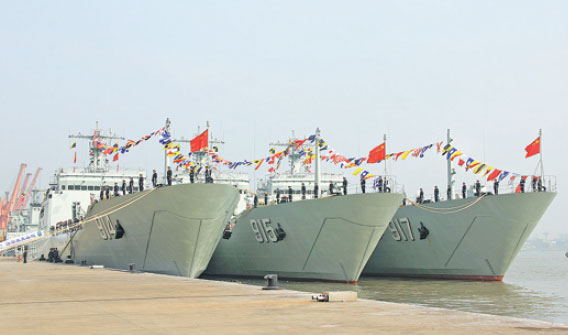 Three vessels, CNS Wuyishan, CNS Culaishan and CNS Wutaishan, are delivered to the East Sea Fleet at an unidentified naval port on Monday. Zhou Pengcheng / China News Service