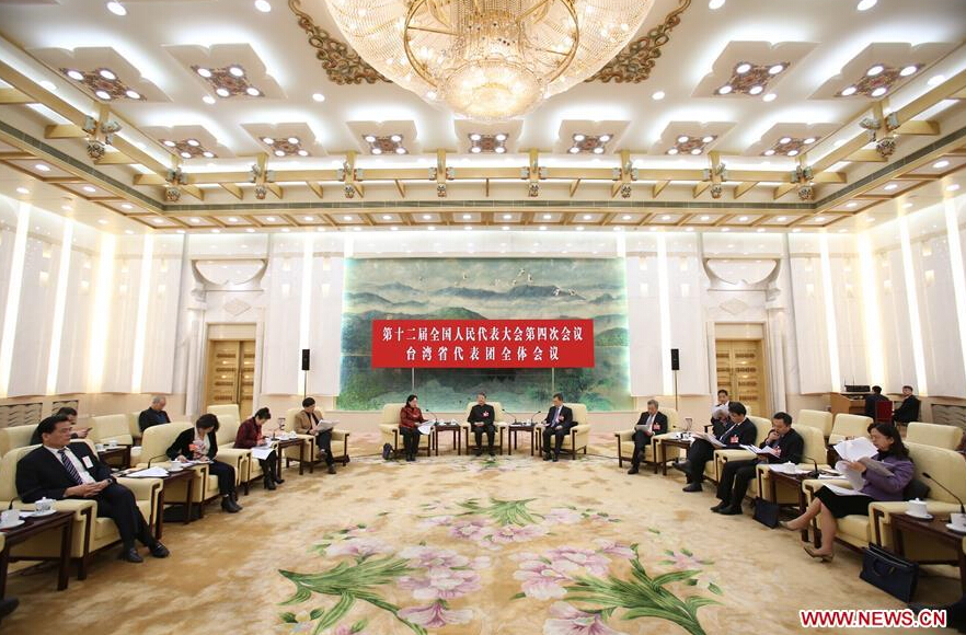 A plenary meeting of deputies from southeast China's Taiwan to the fourth session of the 12th National People's Congress is held in Beijing, capital of China, March 10, 2016. (Xinhua/Zhang Cheng) 