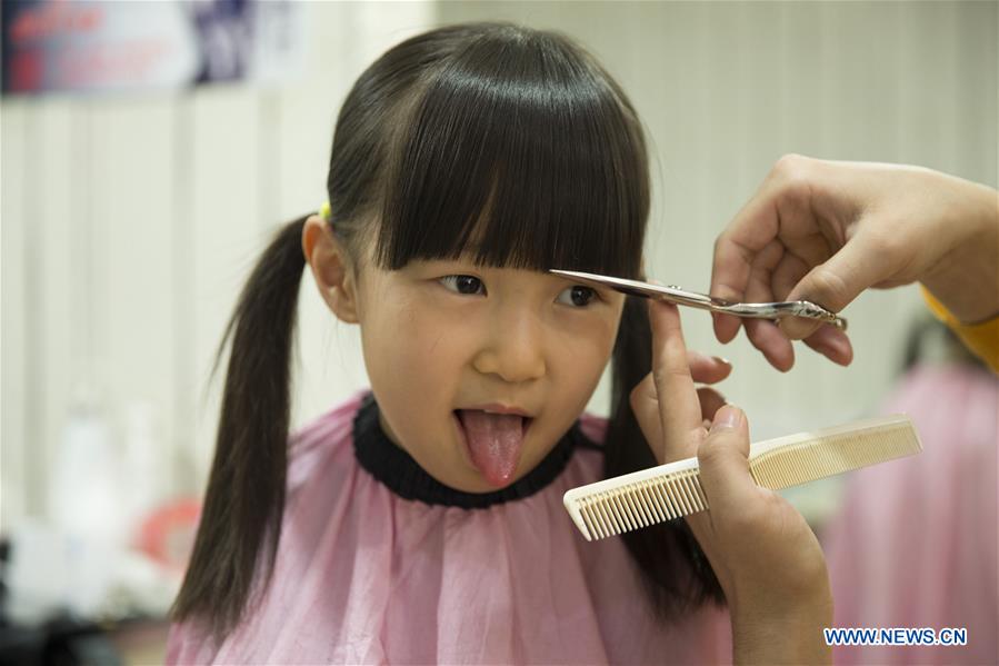 Chinese kids get 'lucky haircuts'- China.org.cn