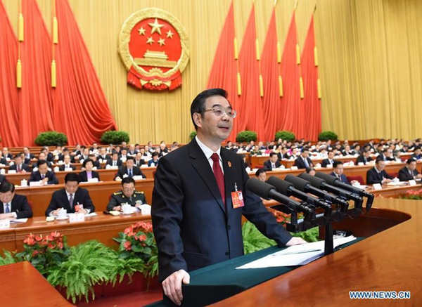 Zhou Qiang, president of the Supreme People's Court (SPC), delivers a report on the SPC's work during the third plenary meeting of the fourth session of China's 12th National People's Congress at the Great Hall of the People in Beijing, capital of China, March 13, 2016. [Xinhua]