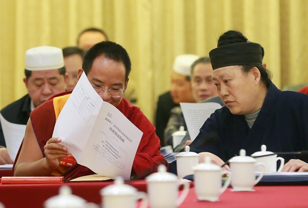 The 11th Panchen Lama, Bainqen Erdini Qoigyijabu, attends a panel discussion of the 12th National Committee of the Chinese People's Political Consultative Conference on Sunday. [Zou Hong / China Daily] 