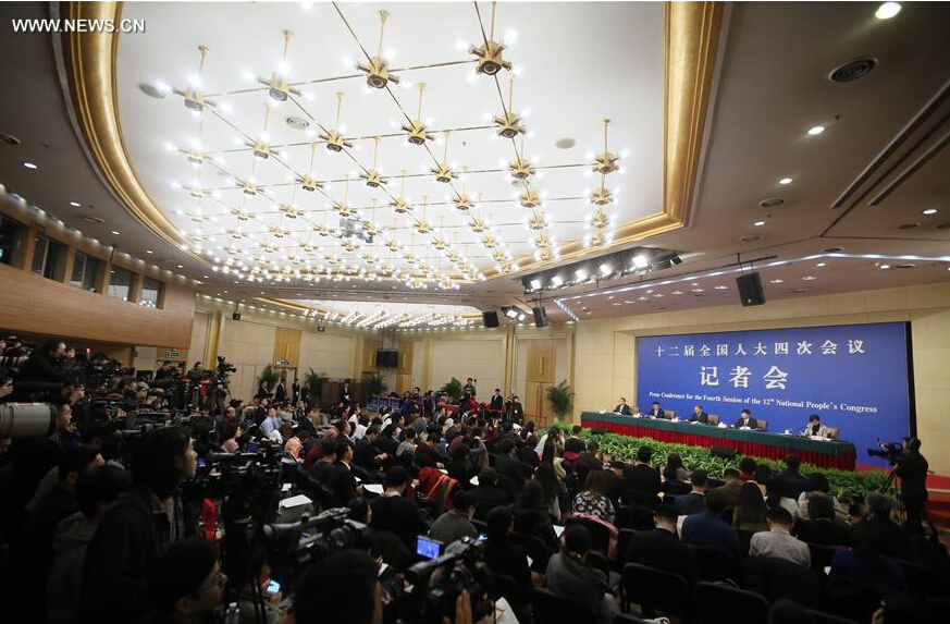 Chinese Minister of Transport Yang Chuantang, Director General of Transport Service Department of the Ministry of Transport Liu Xiaoming and Director of Beijing Transportation Research Center Guo Jifu give a press conference on reform and development of taxi on the sidelines of the fourth session of the 12th National People's Congress in Beijing, capital of China, March 14, 2016. (Xinhua/Chen Junqing) 