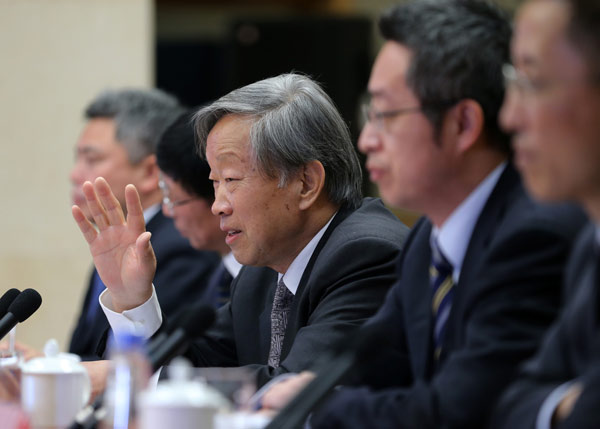 Liu Hainian, head of the human rights research center of the Chinese Academy of Social Sciences, addresses a news conference on Monday on US human rights.[Photo by Wang Zhuangfei/China Daily]