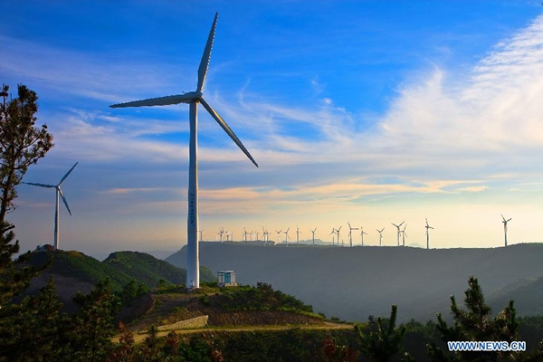 Photo taken on Oct. 8, 2015 shows the wind turbines at the Tangshan wind power plant in Qixia City, east China's Shandong Province. [Xinhua]