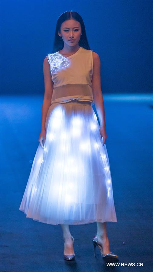 A model presents a creation designed by students of Beijing Institute of Fashion Technology during a fashion week of the institute in Beijing, capital of China, March 18, 2016. The fashion week concluded on Friday. [Photo/Xinhua]