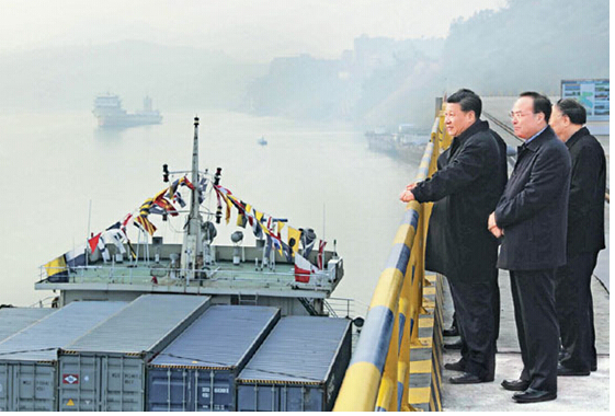 President Xi Jinping (L) inspects Guoyuan Port in the Liangjiang New Area of southwest China's Chongqing on January 4, his first workday of the New Year.