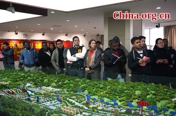 Foreign students from the International Master of Business Administration program pay a visit to Shangdan Industrial District on March 23 in Shangluo City, Shaanxi Province. [Photo by Lin Liyao/China.org.cn]