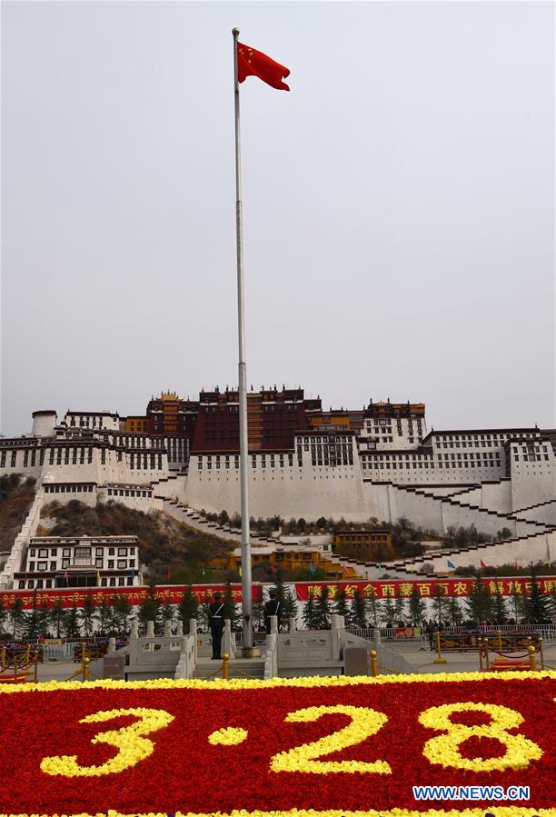 A flag-raising ceremony is held to celebrate the Serfs' Emancipation Day in Lhasa, southwest China's Tibet Autonomous Region, March 28, 2016. In 2009, March 28 was designated as the day to mark the freeing of 1 million people, or 90 percent of the region's population at that time, from the feudal serf system in 1959. [Photo: Xinhua]