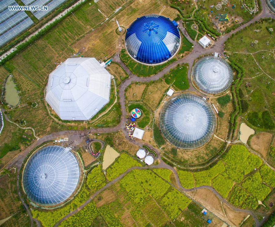 An aerial photo taken on April 9, 2016 shows dome greenhouses in Tiantai County, east China&apos;s Zhejiang Province.