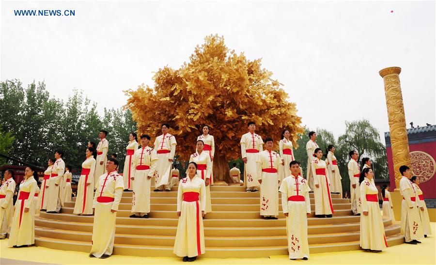 Actors perform during an ancestor worship grand ceremony in honor of Huangdi, the Yellow Emperor, held at mausoleums in Xinzheng, central China&apos;s Henan Province, Huangdi&apos;s birth place, on April 9, 2016, the third day of the third month on the Chinese lunar calendar, which is considered the birthday of Huangdi. 