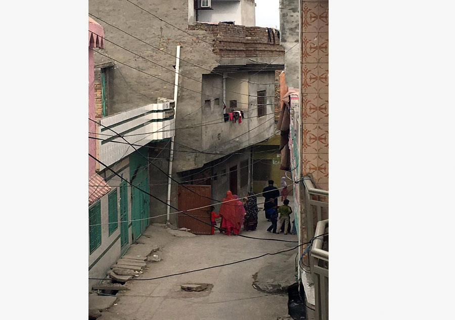 Photo taken by mobile phone on April 10, 2016 shows people come out from a house after a massive earthquake in Rawalpindi, Pakistan. An earthquake with a magnitude of 7.1 on the Richter scale jolted parts of Afghanistan, Pakistan and India, killing two and injuring 25 in Pakistan on Sunday. [Photo/Xinhua]