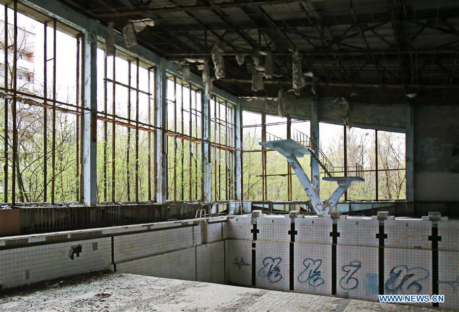 Photo taken on April 19, 2016 shows a deserted swimming pool in Pripyat city near the Chernobyl nuclear power plant, Ukraine. Chernobyl, a place replete with horrific memories in northern Ukraine, close to Belarus, is now open to tourists, almost 30 years to the date after a nuclear power plant there exploded. [Photo/Xinhua]