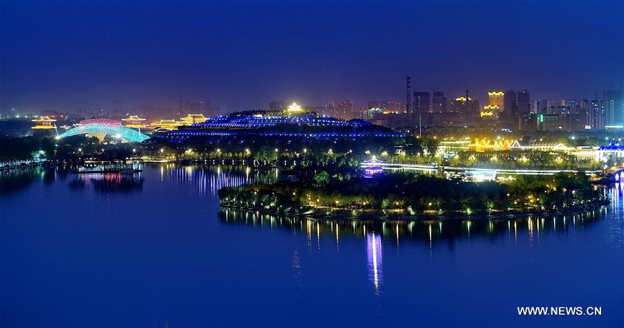 Photo taken on April 22, 2016 shows the night view of the Tangshan International Horticultural Exposition 2016 in Tangshan City, north China's Hebei Province. The 171-day expo will kick off here on April 29. The expo venue was originally a century-old mine in China's iron town of Tangshan. [Xinhua]