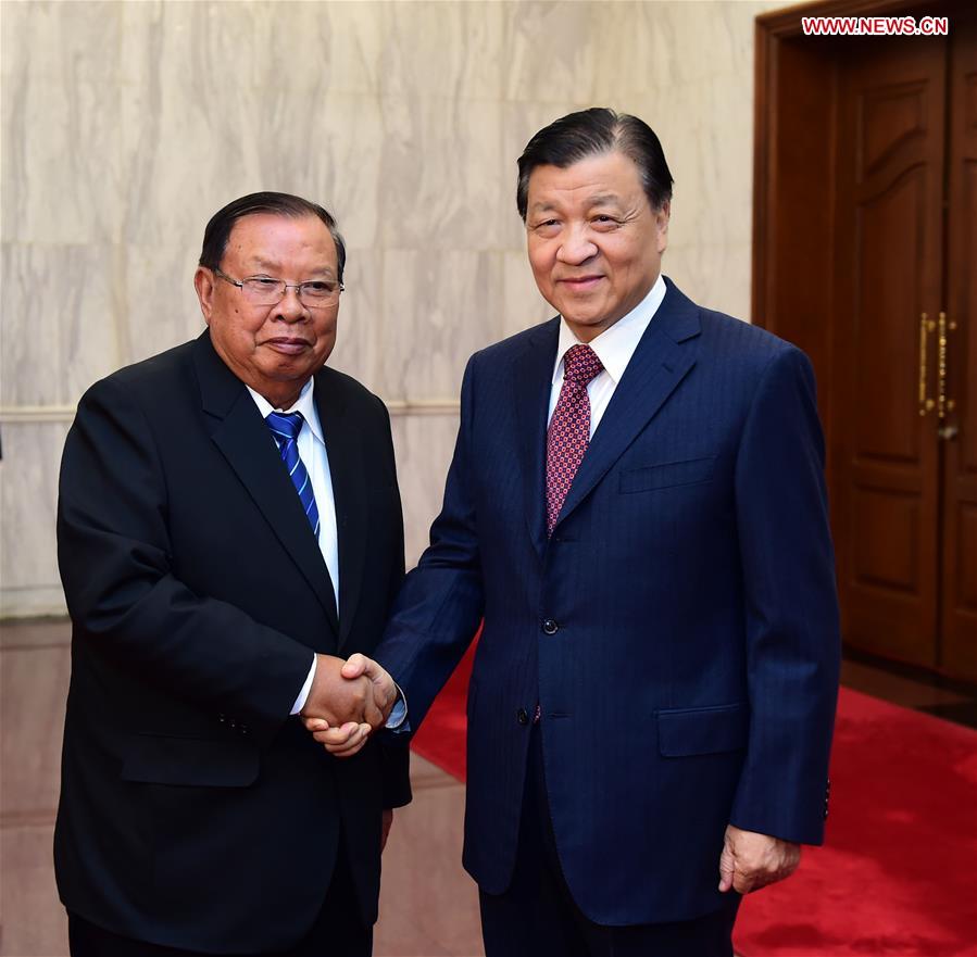 Liu Yunshan (R), a member of the Standing Committee of the Political Bureau of the Communist Party of China (CPC) Central Committee, meets with Lao President Bounnhang Vorachit, also General Secretary of the Central Committee of the Lao People's Revolutionary Party, in Beijing, capital of China, May 4, 2016. [Xinhua] 