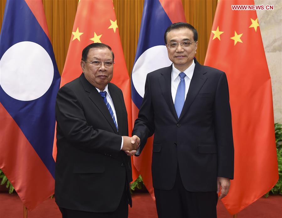 Chinese Premier Li Keqiang (R) meets with Lao President Bounnhang Vorachit, also General Secretary of the Central Committee of the Lao People's Revolutionary Party, in Beijing, capital of China, May 4, 2016. [Xinhua]