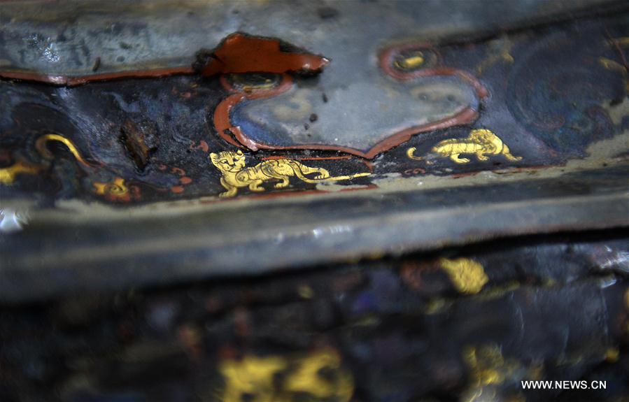 Photo taken on May 4, 2016 shows animal-shaped decorations on a lacquer box unearthed from the 2,000-year-old tomb of Haihunhou, the Marquis of Haihun, in Nanchang, east China's Jiangxi Province.