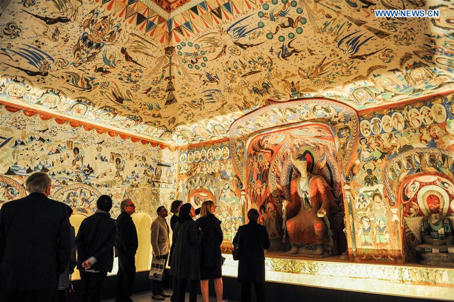 People visit the 'Cave Temples of Dunhuang: Buddhist Art on China's Silk Road' exhibition at Getty Center in Los Angeles, the United States on May 6, 2016. 