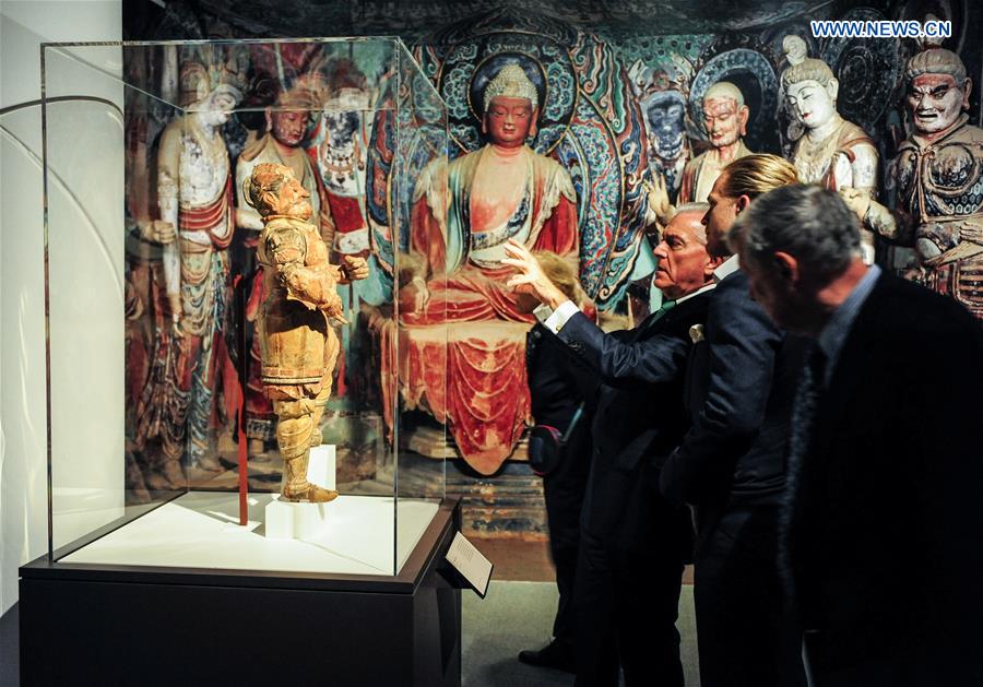 People visit the 'Cave Temples of Dunhuang: Buddhist Art on China's Silk Road' exhibition at Getty Center in Los Angeles, the United States on May 6, 2016. 