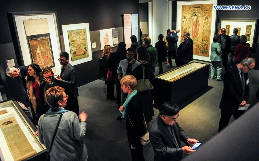 People visit the 'Cave Temples of Dunhuang: Buddhist Art on China's Silk Road' exhibition at Getty Center in Los Angeles, the United States on May 6, 2016. 