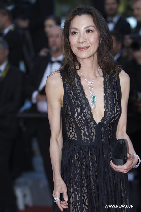 Actress Michelle Yeoh poses on red carpet in Cannes.